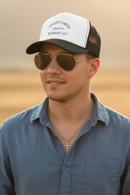Trucker hat with 'Its Just Earth, Chill Out, Romans 12:2' text on a white background
